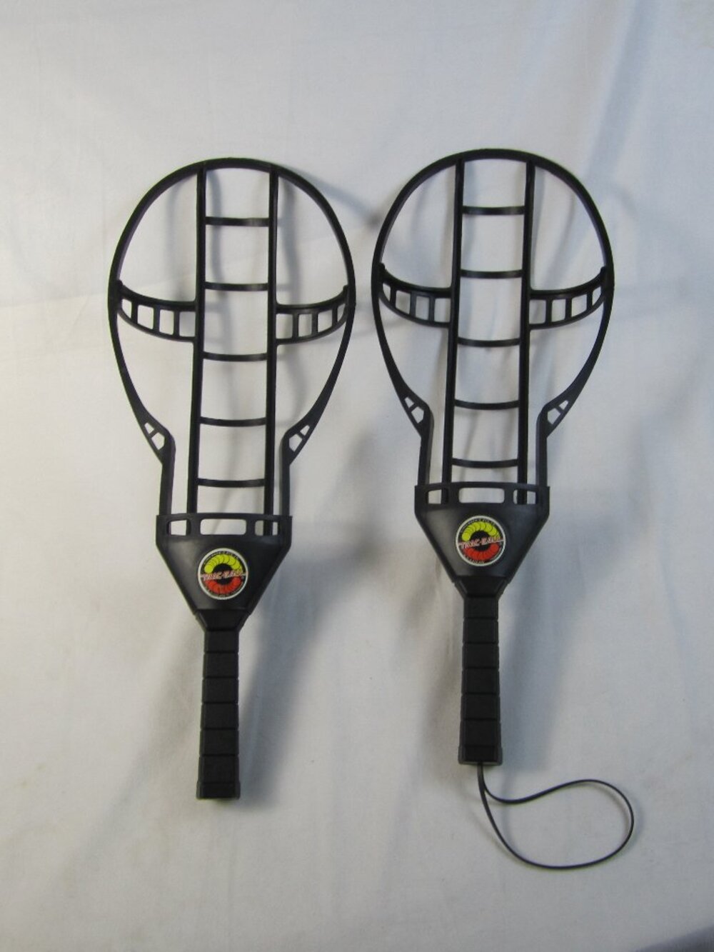 Vintage Wham-O Trac-Ball Set - 2 Black Plastic Racquets 1975